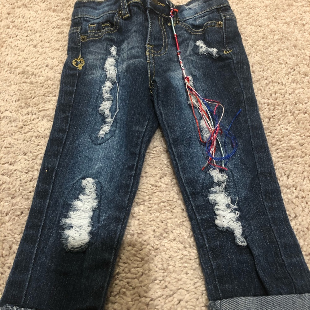 Distressed denim jeans